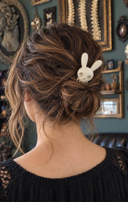 Rabbit skull hair pin worn in a messy bun — ivory gothic bunny hair fork